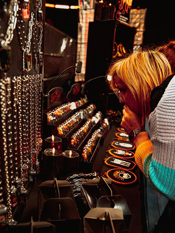 Visitor looking at some of the cool products on one of the trader's stalls